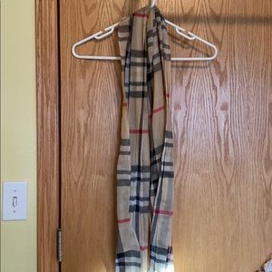 Classic Burberry plaid pattern scarf.